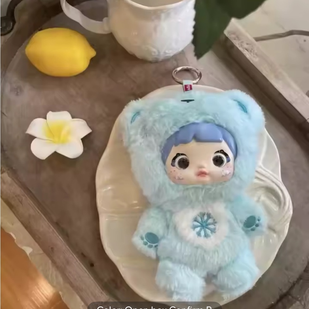 Blue NOMMI plush pendant
